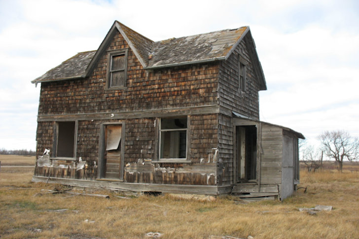 The abandoned home before it was converted