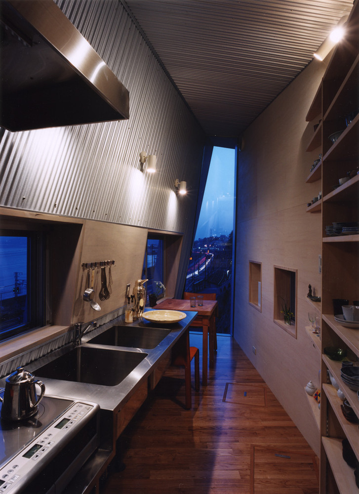 skinny home on a sloped building site galley kitchen