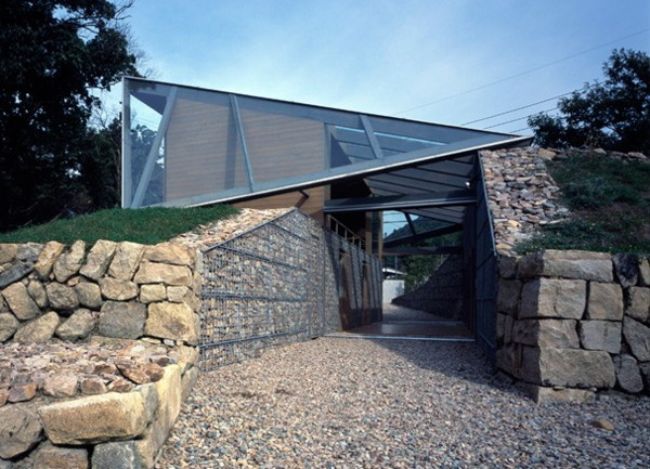 stone glass and wood home