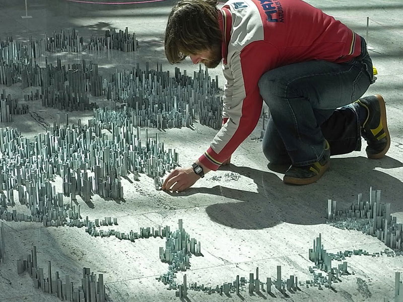 Miniature model city made of staples by Peter Root in progress