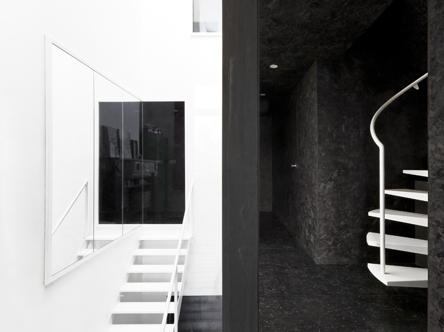 Black and white interior design Fiat Lux curving stairs
