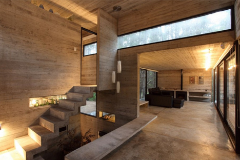 modern masonry: cool concrete cabin + warm wood patio
