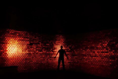 Brick wall with red lights