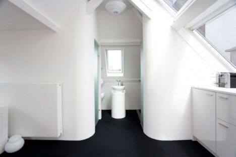 Maff Apartment by Queeste small bathroom curved walls