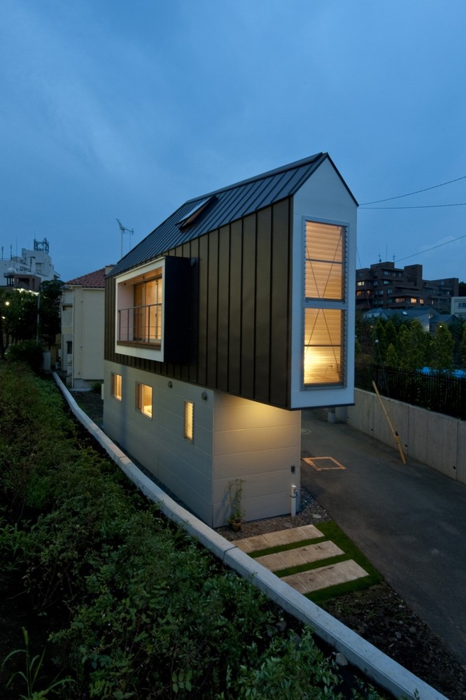 skinny house in japan at night
