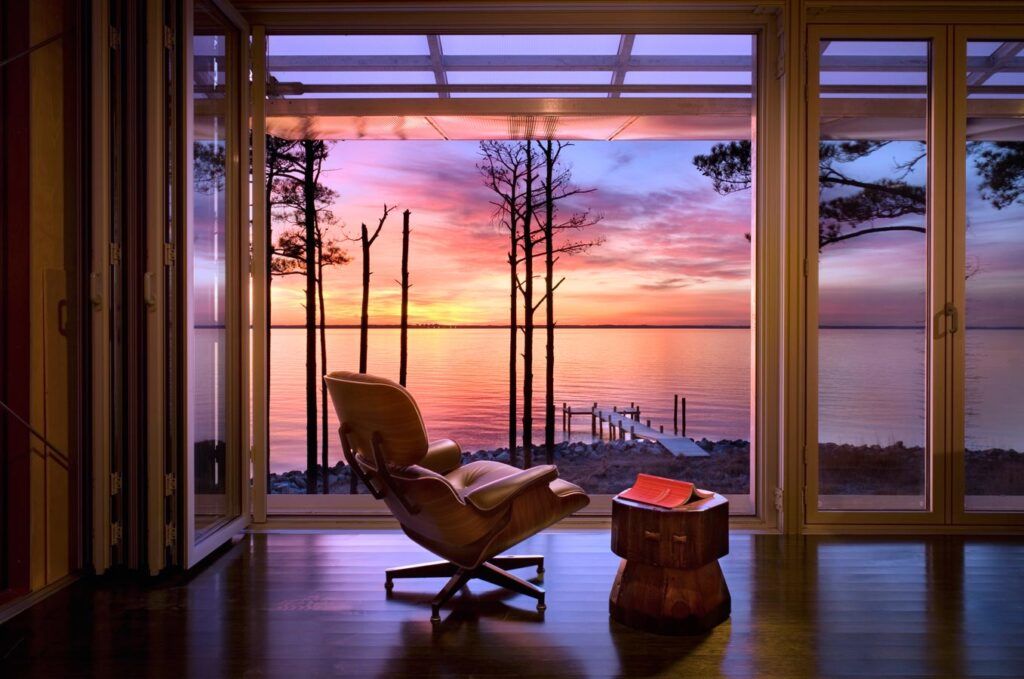 Prefab beach house on stilts sunset