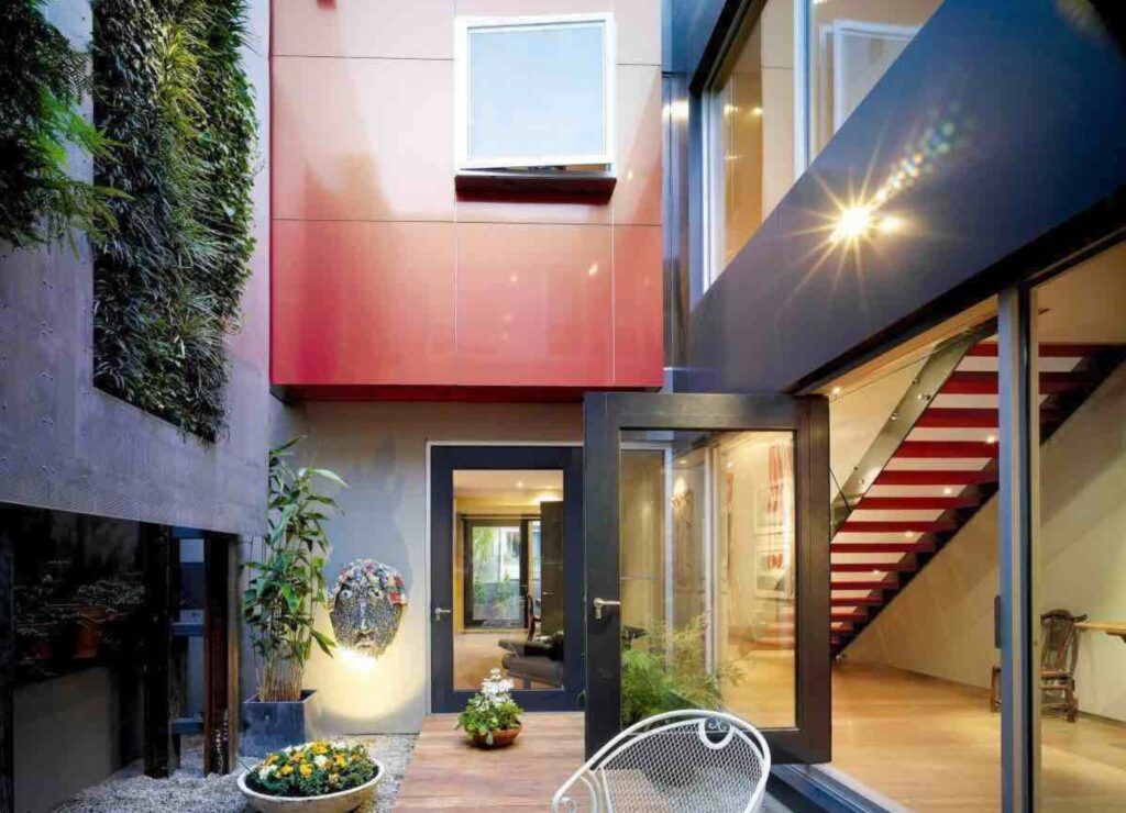 Urban home with vertical gardens stairs courtyard
