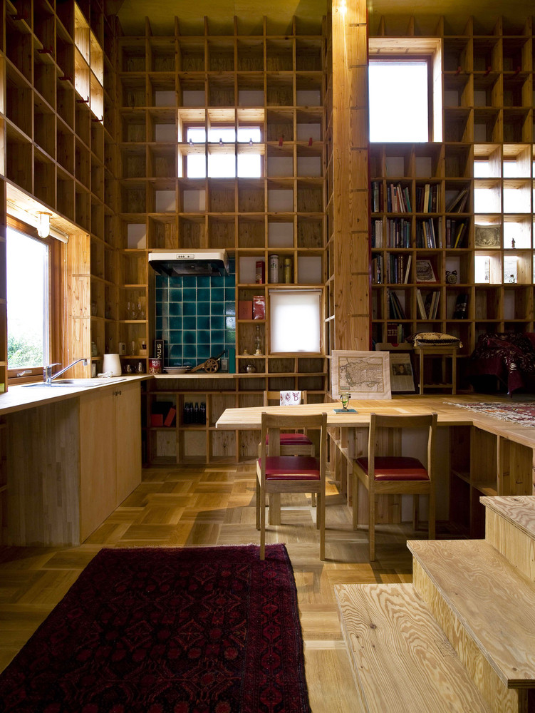 Floor-to-Ceiling Bookshelves at Shelf Pod Home dining table