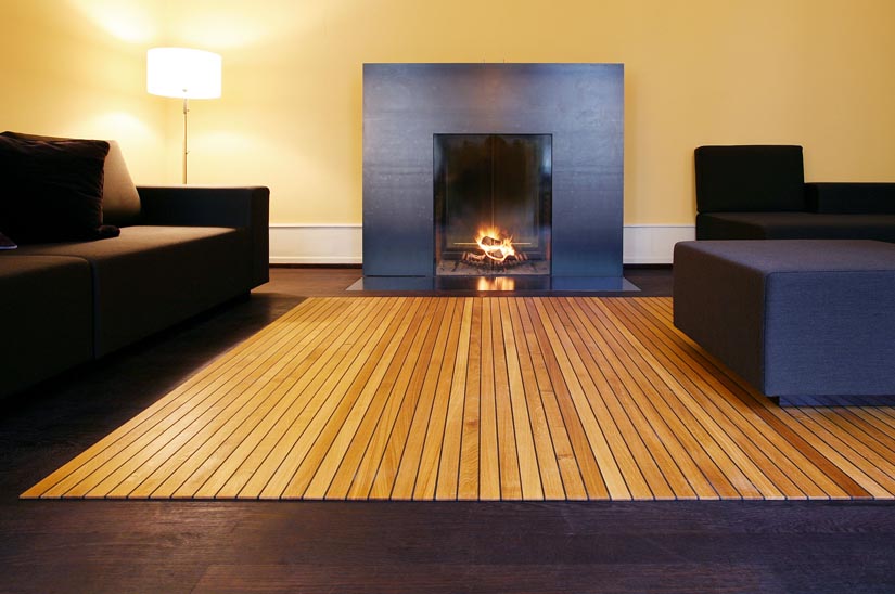 wooden carpet in front of fireplace