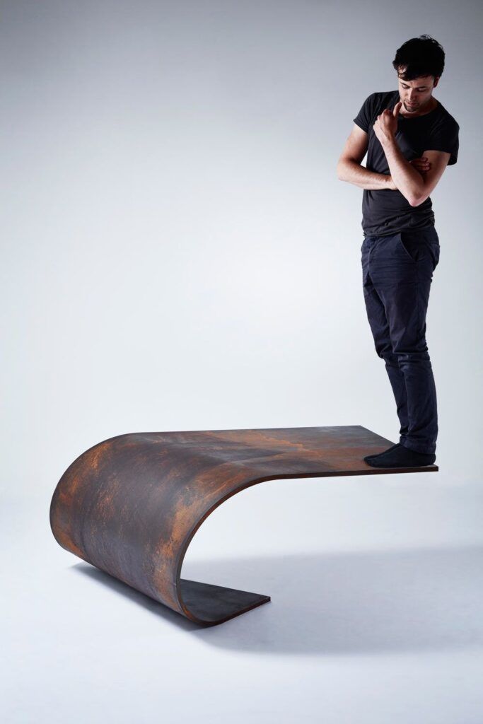 Unique table made of balanced steel paul cocksedge