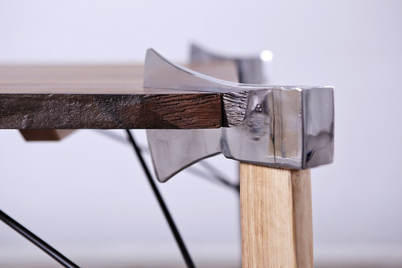 Axes form the legs of this table