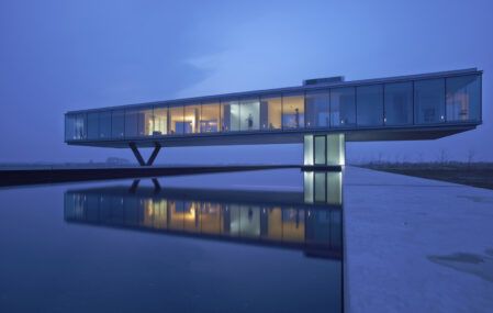 villain's lair with reflecting pool villa kogelhof night