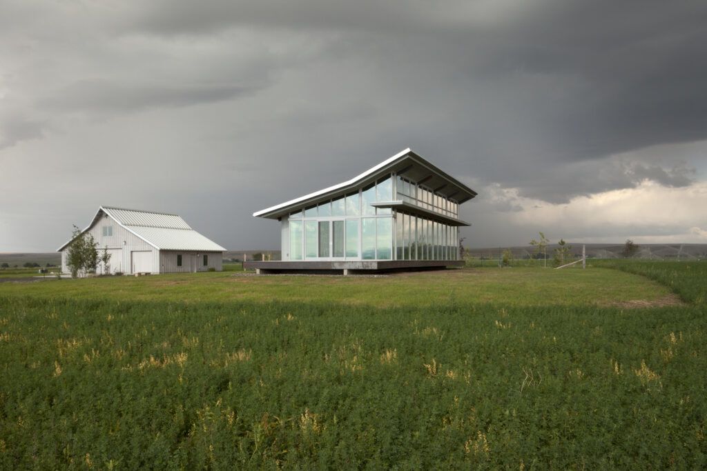 Glass farmhouse in landscape