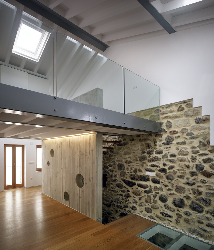 Stone contrasts with glass and wood