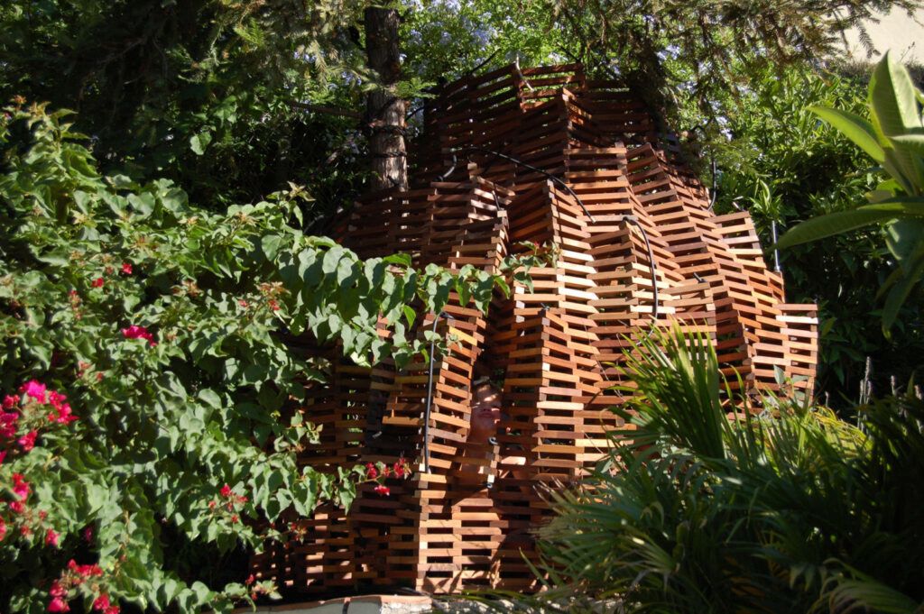 reclaimed wood knit fort in garden