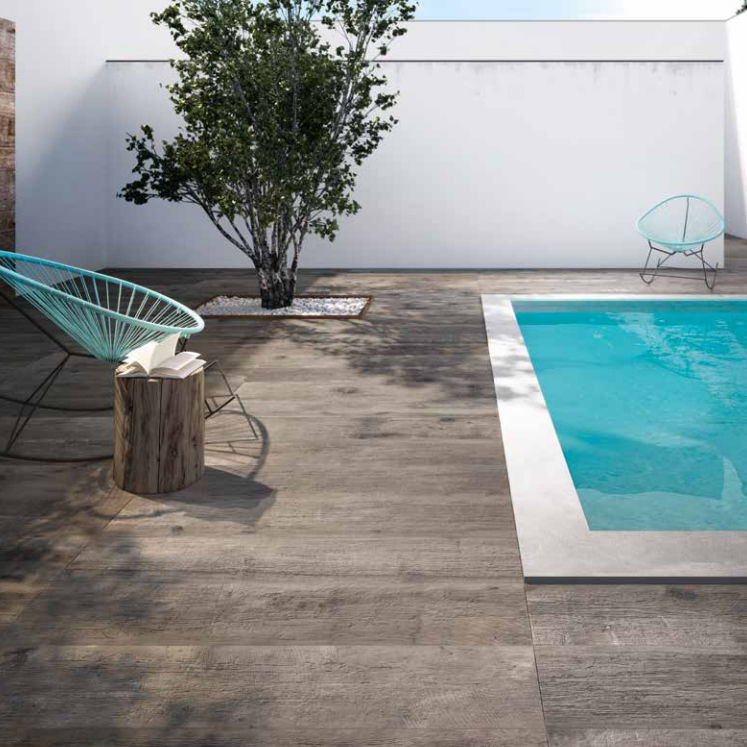 Flaviker Dakota wood tiles surrounding a swimming pool