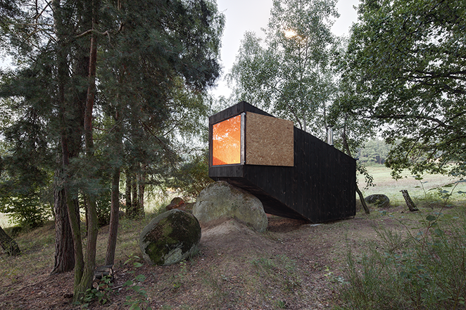 modern forest hut black window open