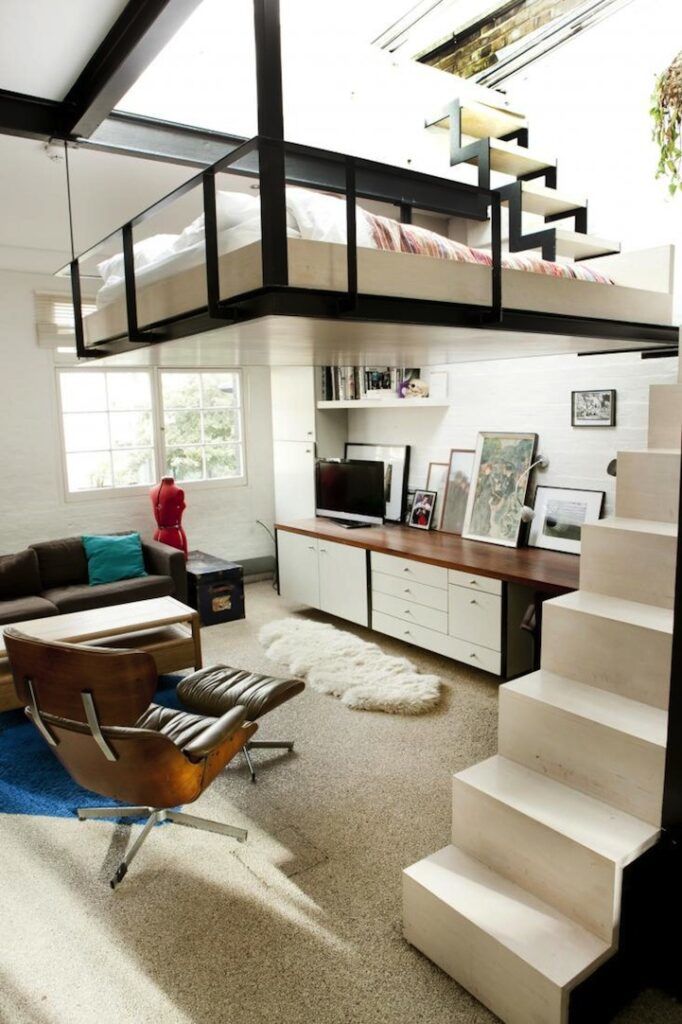 Hanging loft bed in a London apartment black frame