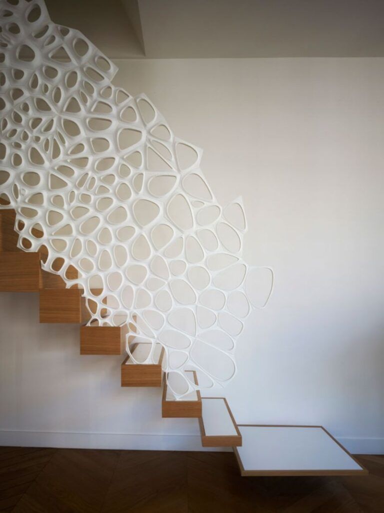 White sculptural staircase railing detail