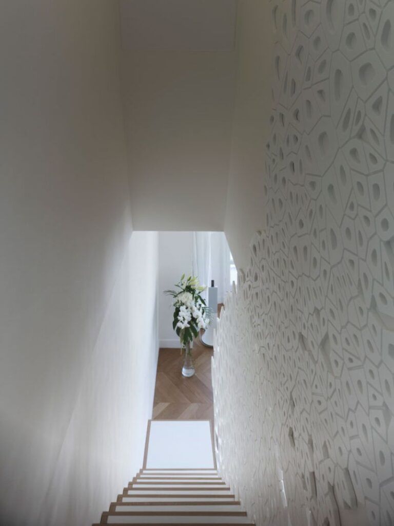 White sculptural staircase railing wall texture