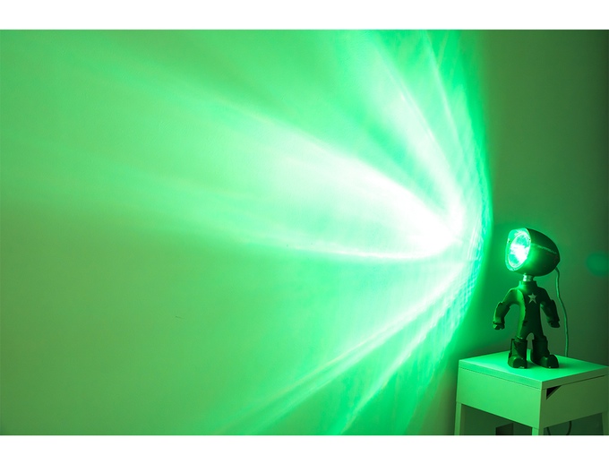 Lampster shining green light on the wall