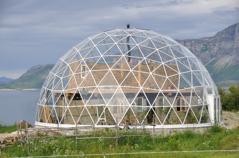 Solar Dome greenhouse over a cob house in the Arctic
