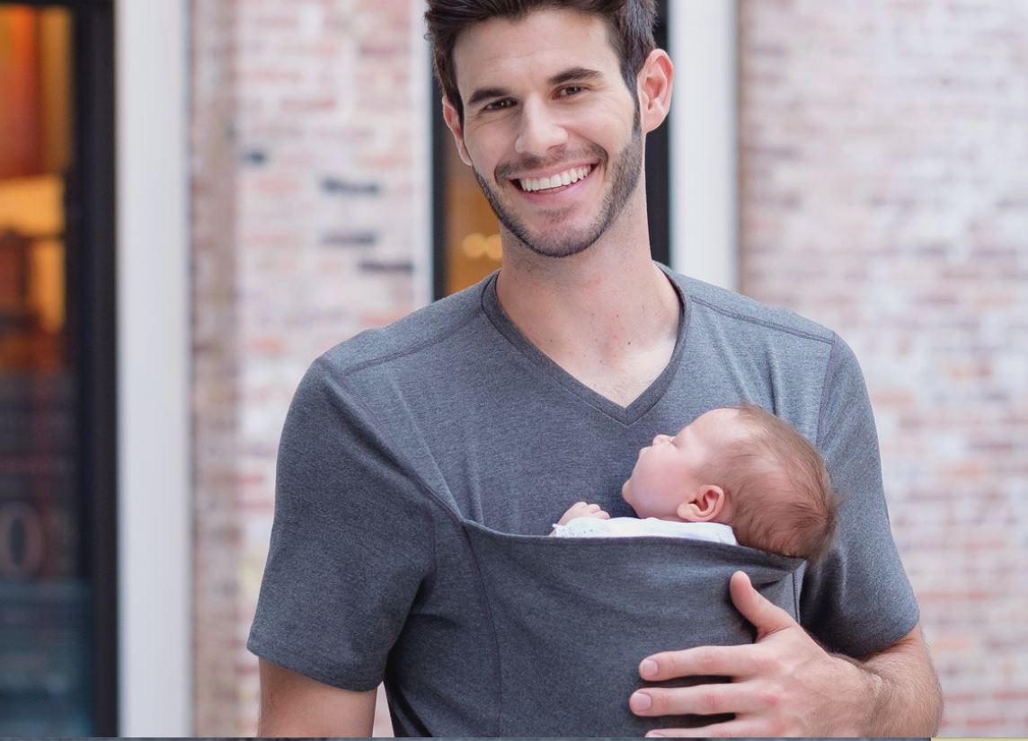 Dad carrying newborn baby - carrier for new moms and dads