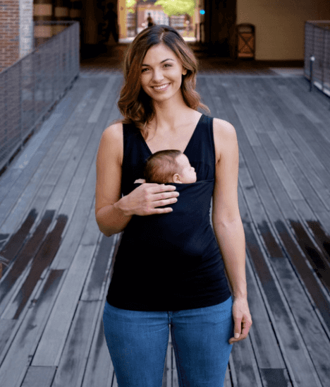 mother wearing tank top holding baby