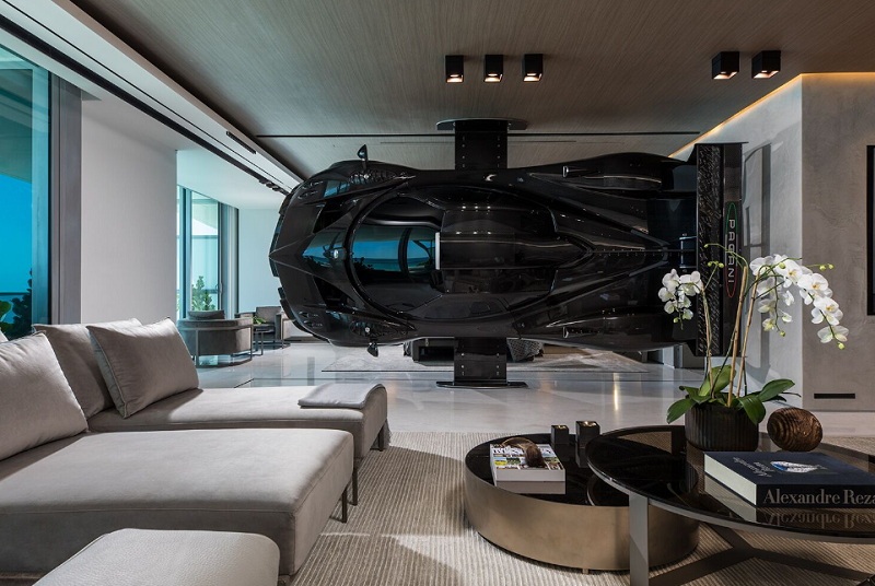 A full-size replica of a Pagani Zonda HP Barchetta being used as a room divider in racecar driver Pablo Pérez Companc's apartment.