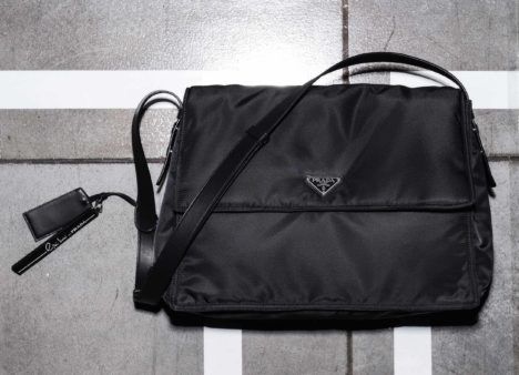 A black nylon Prada bag. 