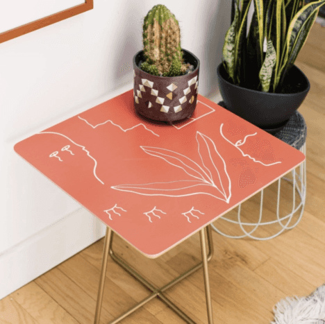 A pink Society side table in a living room