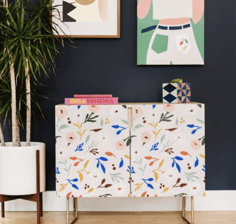 A colorful Society6 credenza in a living room.
