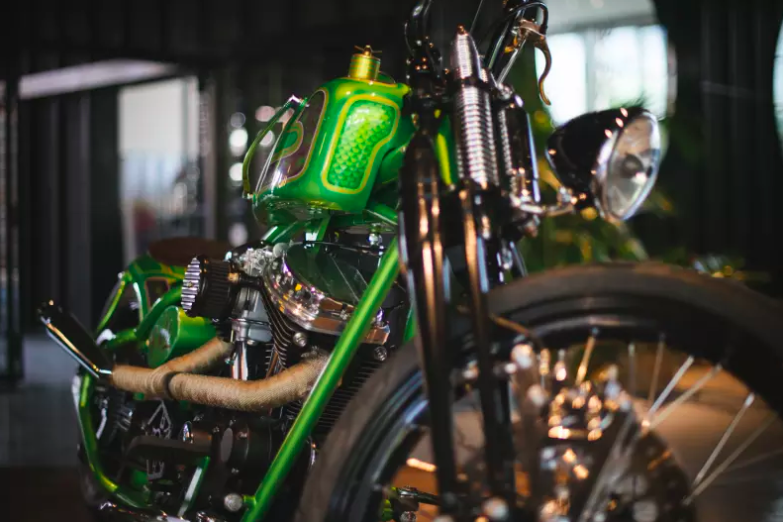 Close-up of a green motorcycle inside the new Filling Station Motel.