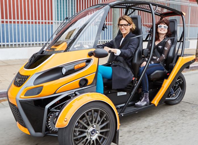 People riding in Acrimoto's new Fun Utility Vehicle (FUV). 
