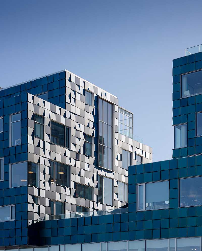 The solar panel-covered facade of the Copenhagen International School Nordhavn