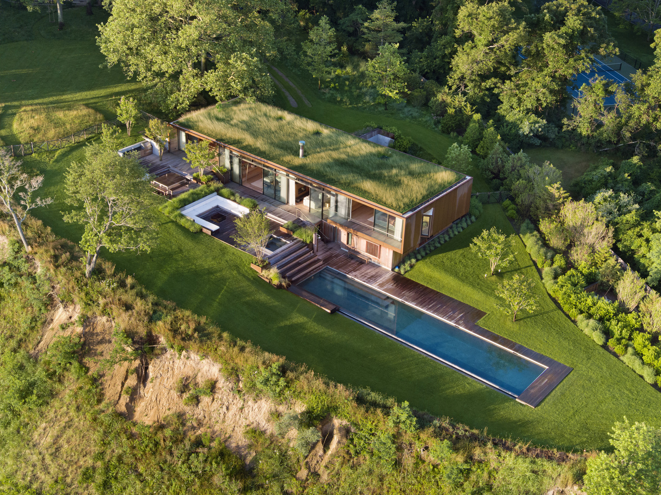 Aerial view of Peconic House, the new nature-inspired Hamptons home by Mapos. 