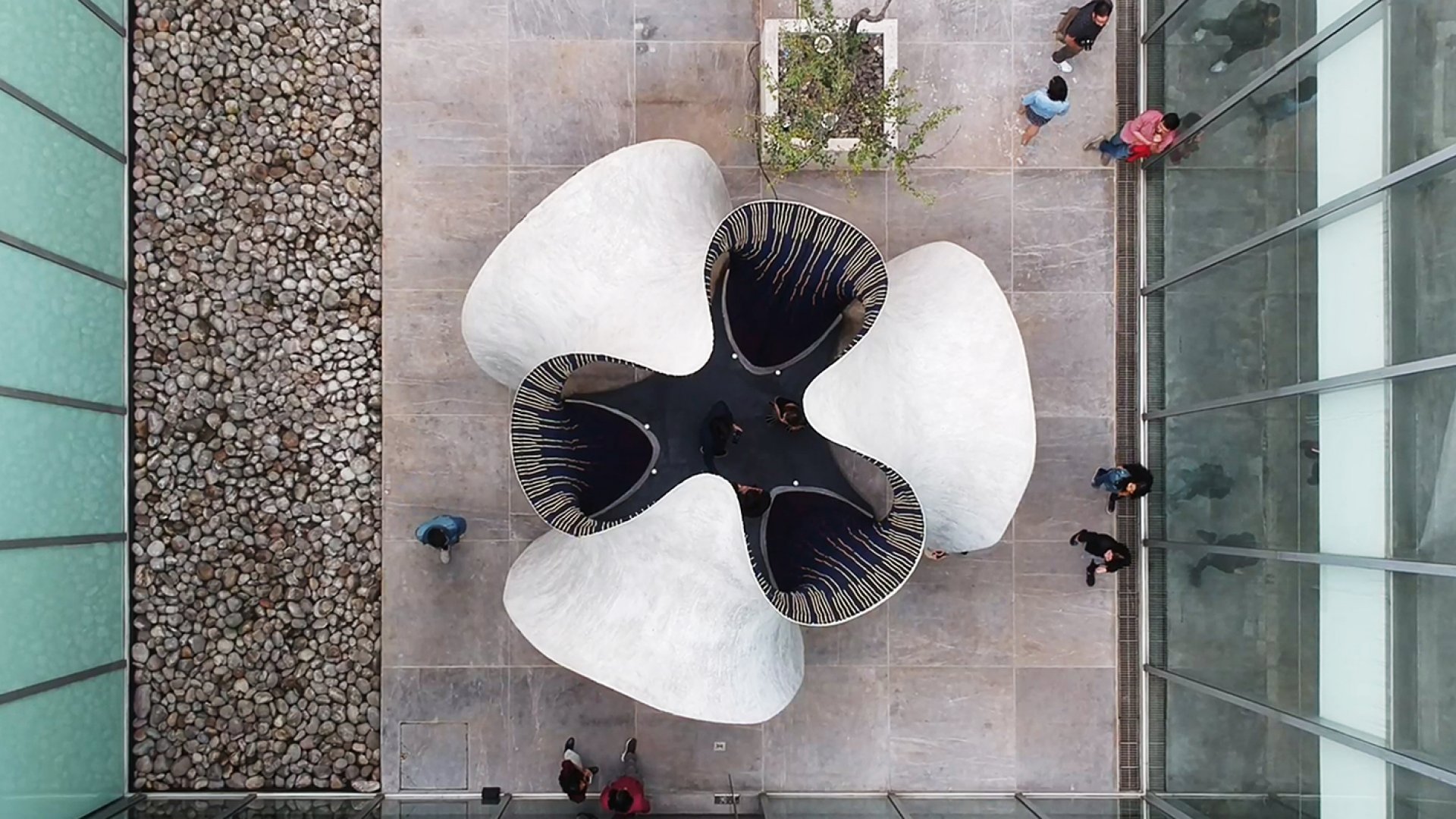 Aerial shot of KnitCandela's abstract concrete exterior. 