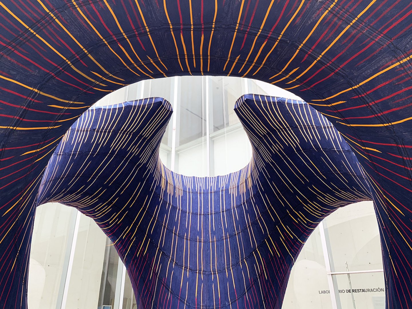 The colorful, textile-based underside of KnitCandela, the new experimental pavilion from Zaha Hadid Achitects and ETH Zurich.