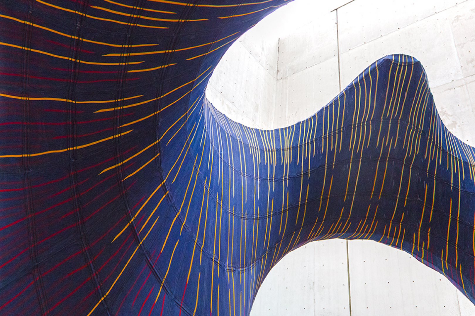 The colorful, textile-based underside of KnitCandela, the new experimental pavilion from Zaha Hadid Achitects and ETH Zurich.