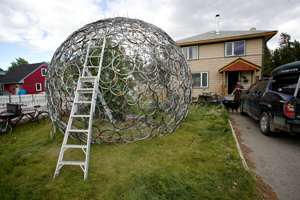 A ladder resting on Philippe LeBlond's Bicycle Tire Dome