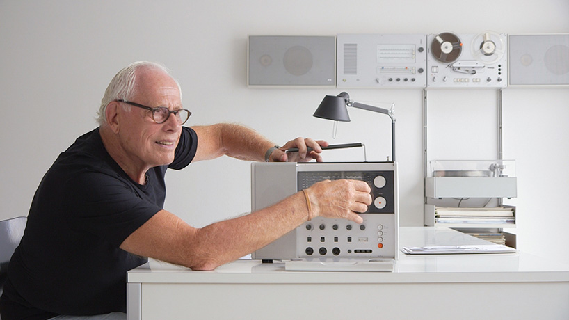 Iconic designer Dieter Rams tinkering with one of his classic radios.