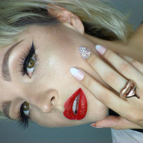 A photo of Vlada Haggerty modeling lipstick.