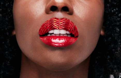 An example of Vlada Haggerty's Lip Art, featuring a glossy, wavy red lipstick design.