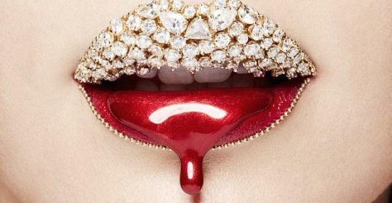 An example of Vlada Haggerty's Lip Art, featuring a diamond-studded lipstick design.