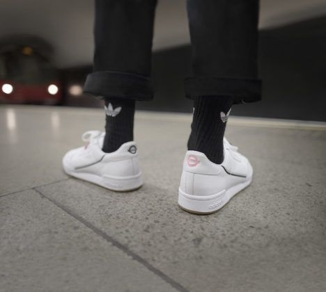 A white pair of shoes featured in the subway-themed Adidas X TfL sneaker collection.