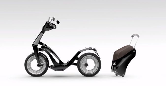 A profile of a UJET electric scooter with its protable battery pack detached.