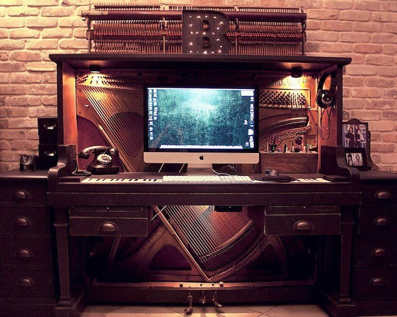 An old piano upcycled into a state-of-the-art work station. 