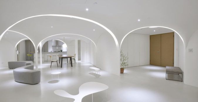 The minimal white interiors of the renovated Sunny Apartment.