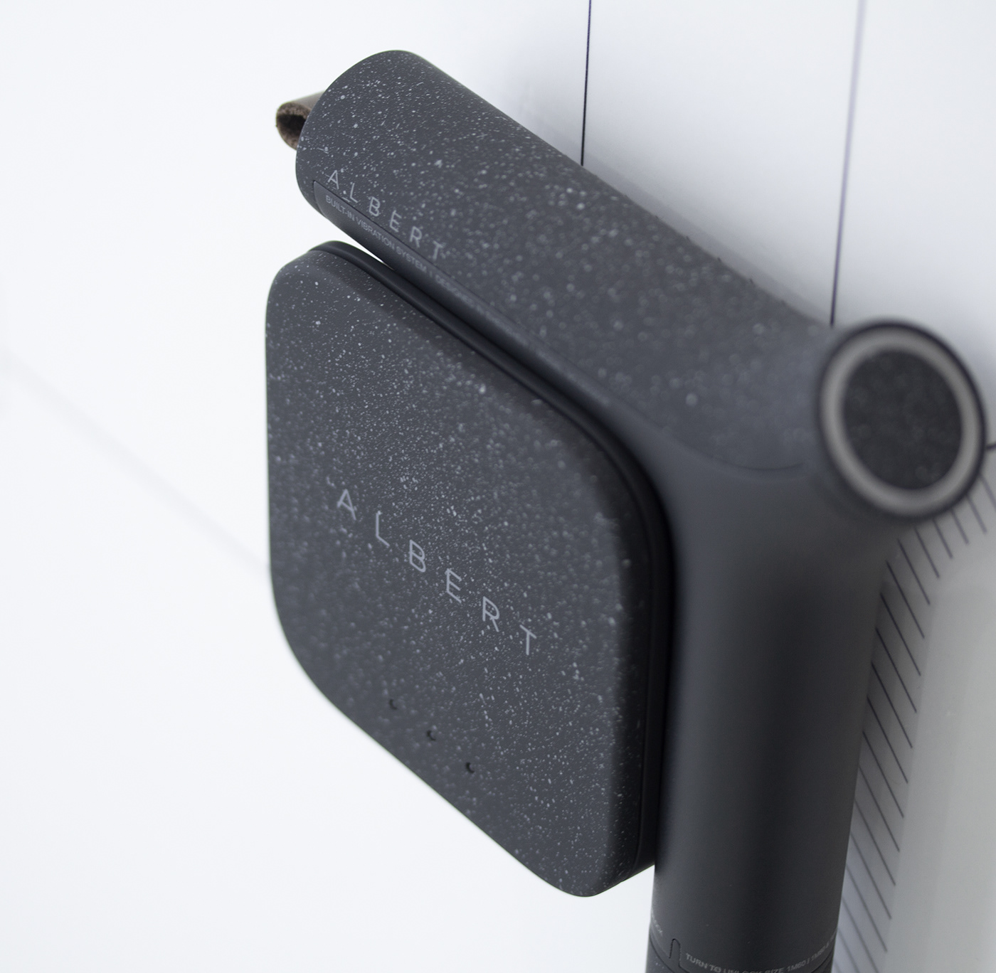The grip of the Albert Cane locked into the cane's wireless charging base.