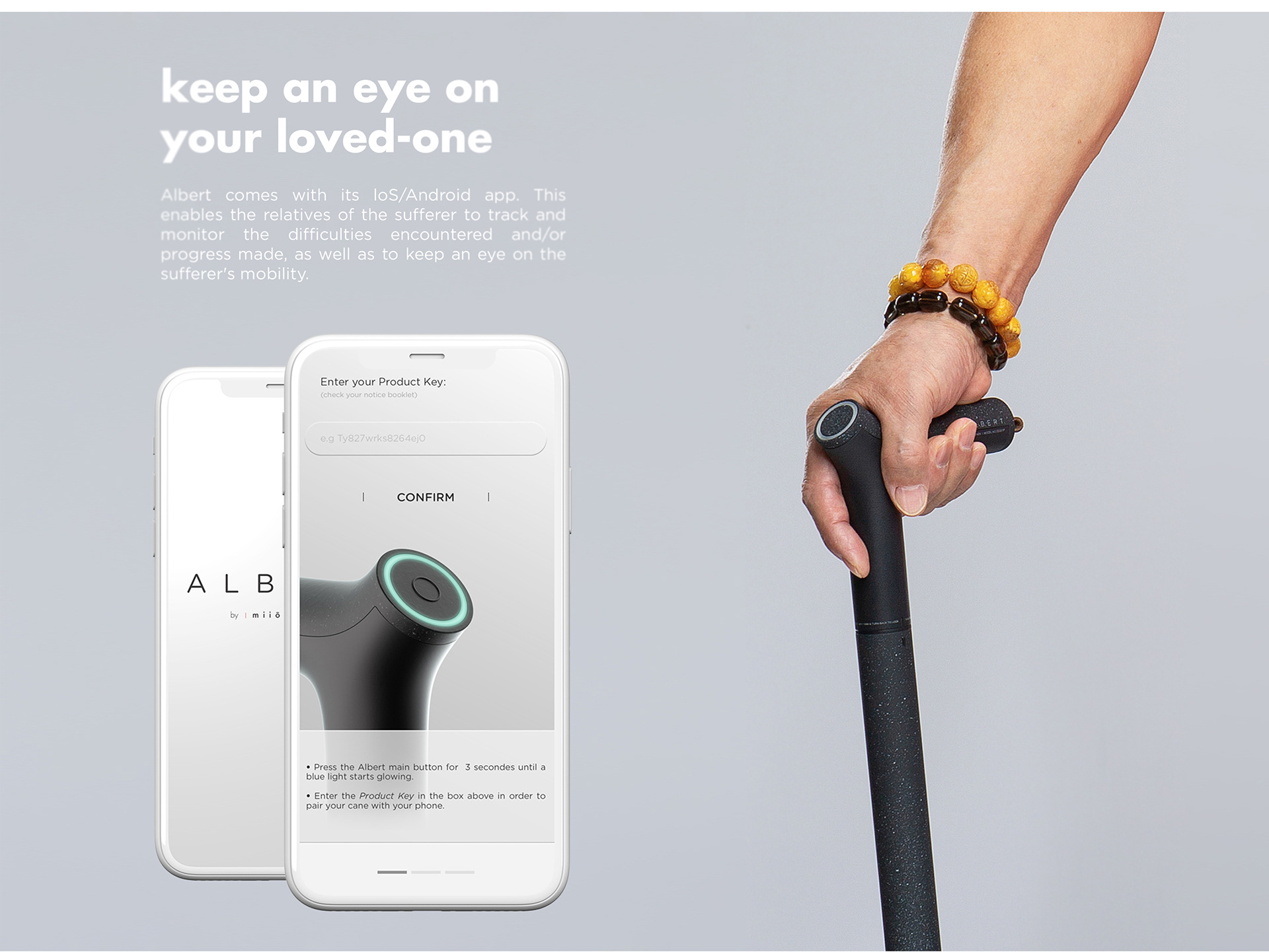 The Albert Cane's accompanying smart phone app displayed next to a hand holding the cane itself. 